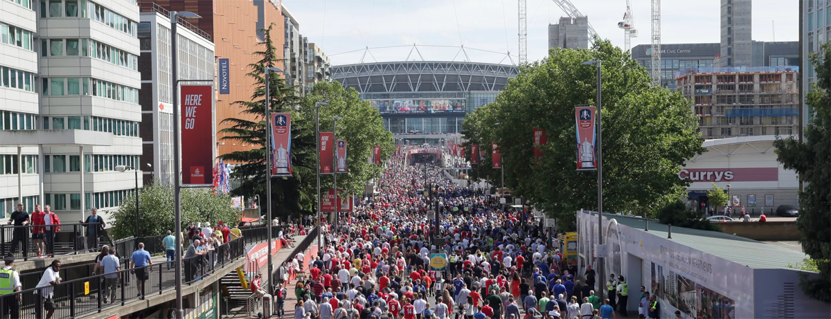 Crowd of football fans walking towards stadium - Away Grounds mission